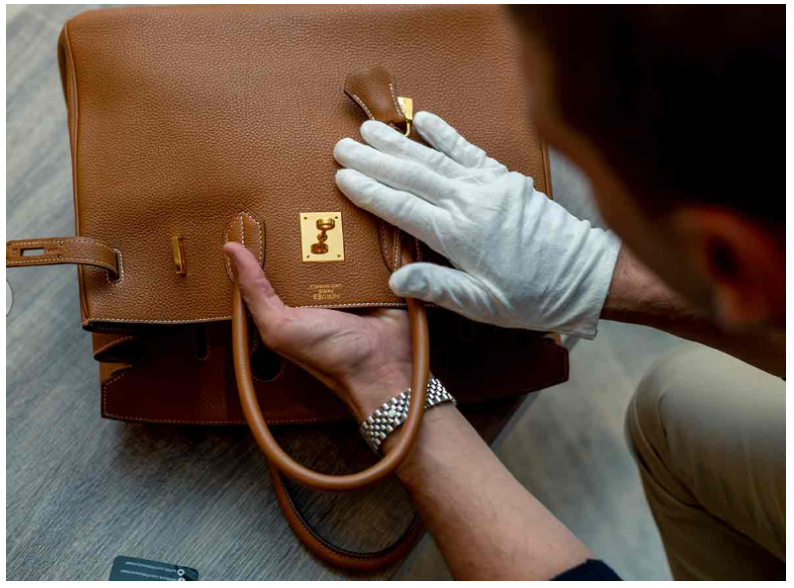 Professional AI authentication process scanning a luxury quilted leather handbag.