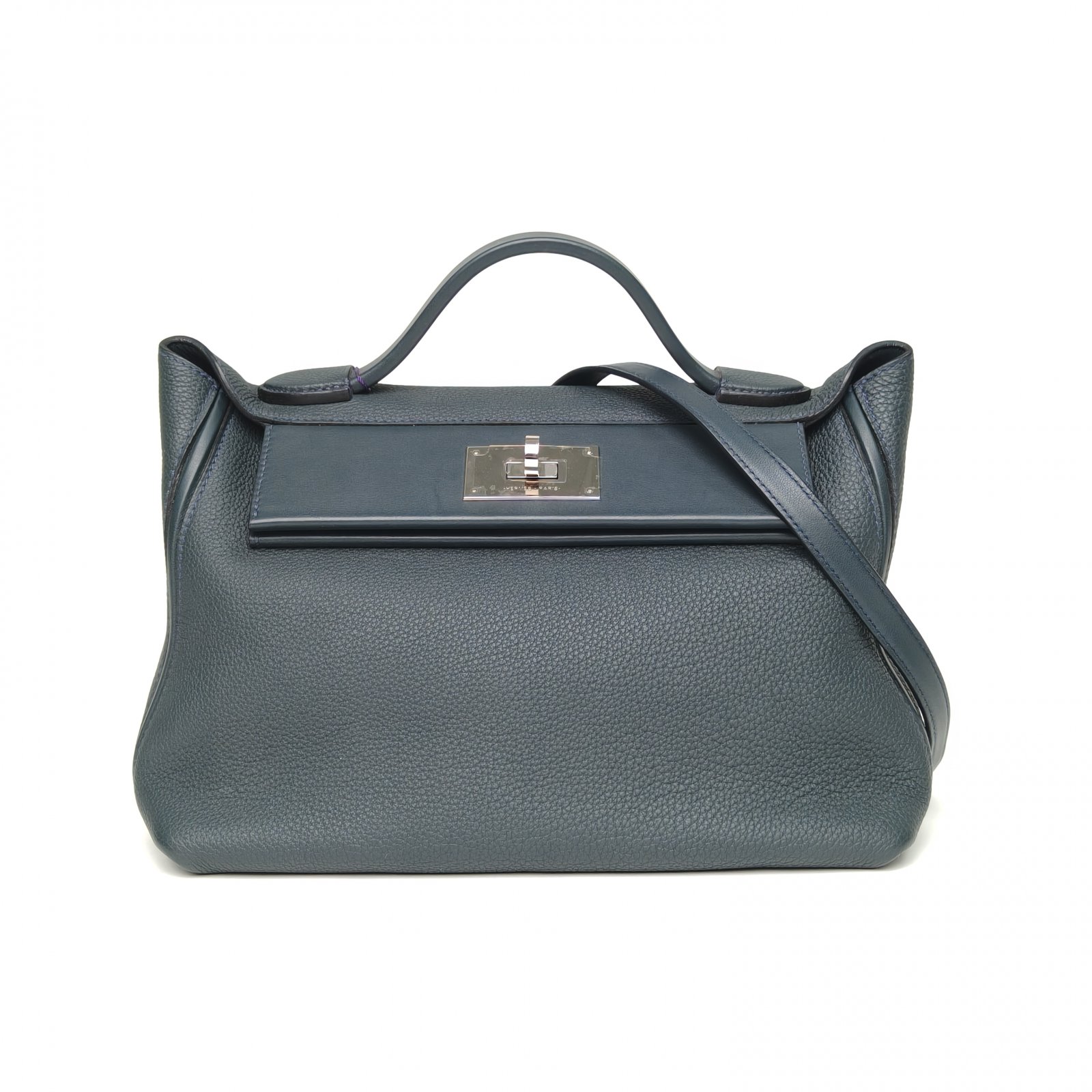 Professional expert authenticating a luxury bag using a digital microscope.