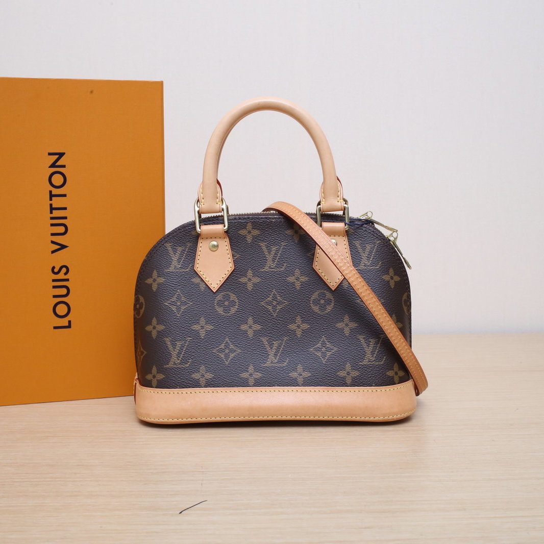 Classic Louis Vuitton Speedy 30 bag in a Parisian café setting.
